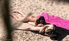 Nudist girlfriend blows that guy on a public beach