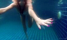 Wendy, a blonde swimmer, takes sensual nude swim in the pool